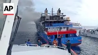 Video shows people in water as passenger ferry catches fire in Indonesia