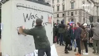 Young Man Steps Forward To Rescue Churchill Statue.