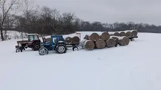 Loading Wagon Trains of Round Bales in the Snow