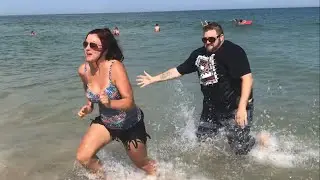 Loving Husband Helps Wife into the Ocean - Relationship Feelings
