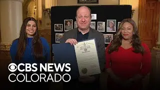 Gov. Jared Polis reads the 