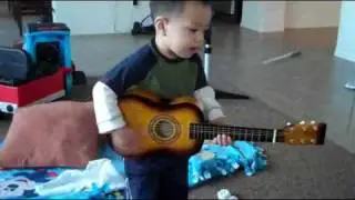 Baby Boy Playing Guitar