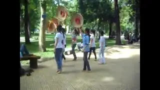 Delightful students practicing their vigorous dance routines in the park in HCMC, Vietnam.