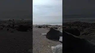 Beach walking to a cave in West Wales.