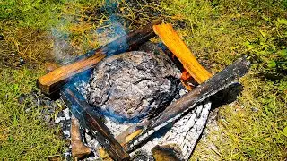The chicken is grilled inside the mud layer. Cooking alone in the forest