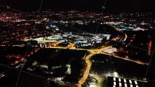 Stunning Nighttime Aerial View of a Vibrant Urban Landscape Showcasing Illuminated Roadways