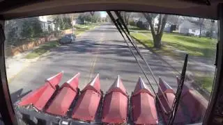 Driving the Combine Through Town-Faribault