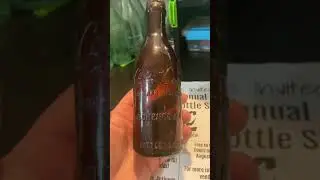 Straight side amber mid script slug plate Coca Cola bottle from Florence Alabama