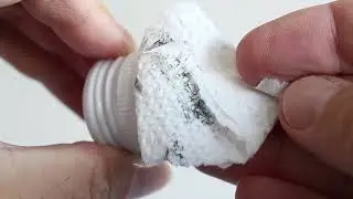 Black on the inside of a strong booze (strong, drinkable alcohol) bottle cap