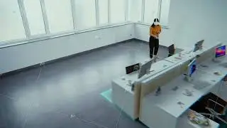 Asian female designer in VR headset builds office workspace with 3D furniture