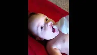 Baby boy leo and a bottle