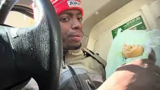 Eating a sub sandwich and chilling at work 