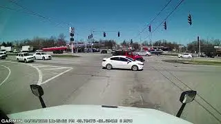 Paullin Milk Cartage driver plows through red light.