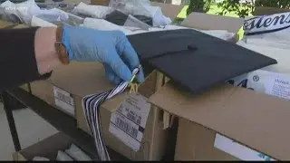 Gray Collegiate holds drive-through pickup for caps and gowns