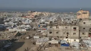 People in Khan Younis react after UN approves Trump administration's Gaza plans
