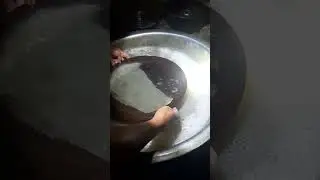 Separating fine gold from blacksand using a sample pan.