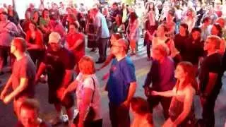 Jordan Wax teaches the crowd how to dance to The David Wax Museum's 