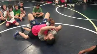Jordan Barreras& Coach Mike Barreras teaching wrestlers to 