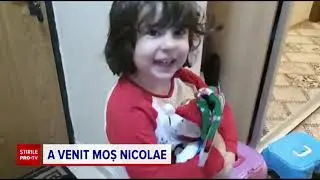 Bucurie uriaşă pentru copiii care și-au găsit ghetuțele pline de cadouri de la Moș Nicolae