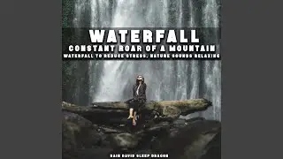 Large Waterfall Flowing from Distant Perspective with Heavy Rumble