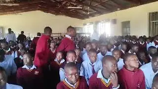 YCS PERFORMING A SONG DURING SUNDAY SERVICE AT SAOS BOYS HIGH SCHOOL.