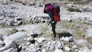 Tricky river crossing: Himalayan fast flowing stream gets forded en route Kalindi Khal pass, Garhwal