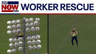 VIDEO: Worker rescued from high up on stadium lights