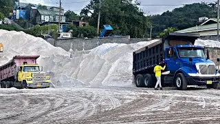 Trucks are off loading 2,400 tons of sand for gravel concrete and emulsion S1:E6
