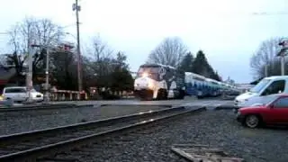 Sounder trains meet; loco on 2nd train has 'Orca' paint scheme
