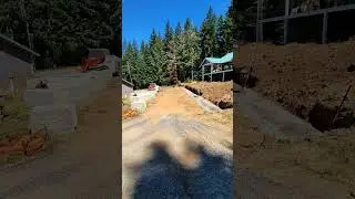 Another wall built this past week.  reclaiming the hillside for usable space.