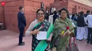 Amid protests, Rahul Gandhi gives national flag to Rajnath Singh as he arrives in Parliament