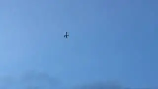 Mike watches P-51 Mustang buzz golf course
