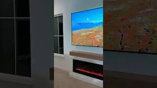 A clean and modern fireplace design with a floating mantel and ambient LED lighting