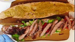 Pork neck and caramelized onion sandwich