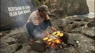 Sendirian mancing ikan dan memanggang do atas tebing yang curam