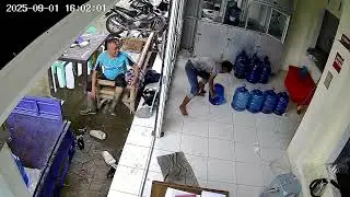 Man Slips Carrying Heavy Water Jug