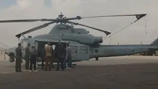 U.S. Marines fly over the Super Bowl LIX Parade in Attack Helicopters