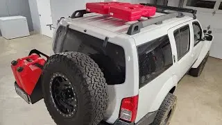 Installing 2 Fuelpaxs by RotoPax on the roof rack | Nissan R51 carrying 19 gallons of Fuel.