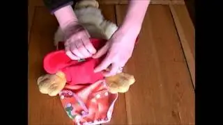 How to put on a TotsBots Bamboozle stretch reusable nappy demo