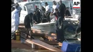 AP pix of rescue operation, after boat capsizes kiling at least 57