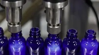 Apex Filling Systems CBD Oil Filling Line With Auto Neck Bander