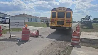 School bus drives through closed road