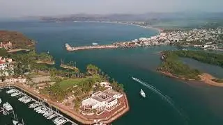 Drone look at Barra De Navidad Mexico & Grand Isla Navidad Golf & Spa Resort with Marina