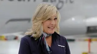 Flight Attendant Angela loves bringing smiles to passengers' faces at this 