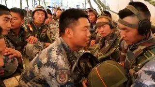 Chinese airborne force holds parachuting drill in central China