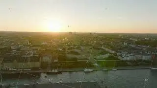 Romantic aerial slide and pan footage of historic Amalienborg palace and Frederiks Kirke dome