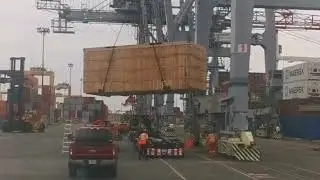 Unloading Of A Cargo Ship. The cargo is accepted at the seaport. Transshipment of cargo. IEC.