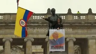 Supporters of former Colombian President &Aacute;lvaro Uribe rally behind him in the streets after his conv