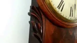 Antique flame mahogany drop dial fusee wall clock. Circa 1860