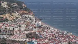 Aerial view of the coastline of the village of Sesimbra day to night timelapse. Portugal
